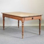 An antique pine kitchen table