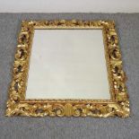 An early 20th century Florentine style gilt framed wall mirror