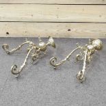 A pair of early 20th century brass twin branch wall lights