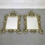 A pair of ornate gilt framed wall mirrors