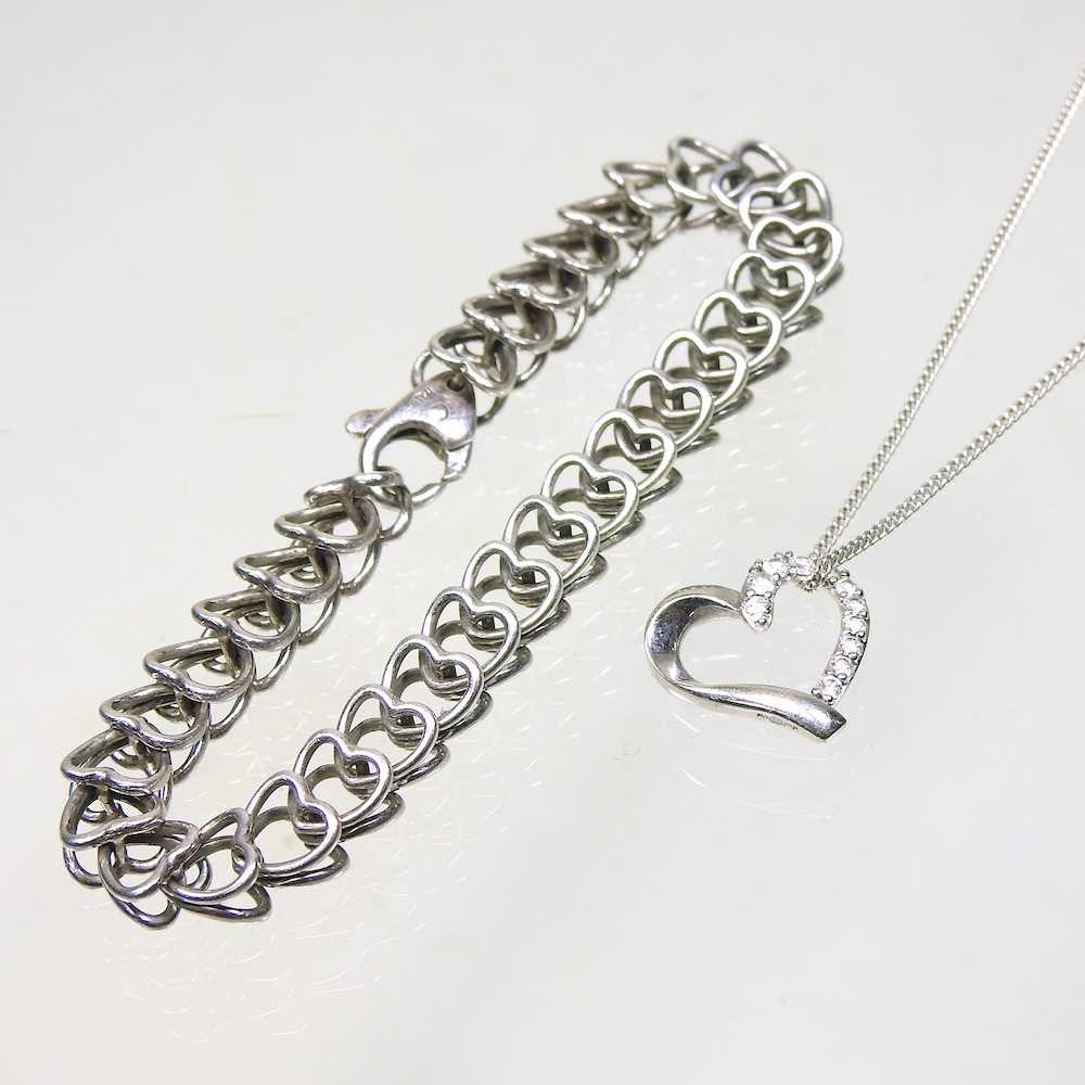 A silver Tiffany heart shaped chain bracelet