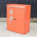 A red painted metal cabinet