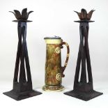 A pair of Arts and Crafts style candlesticks