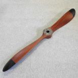 A reproduction wooden propeller