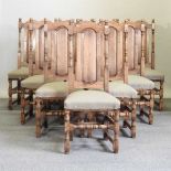 A set of ten 18th century style oak dining chairs