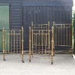 A pair of early 20th century brass single bedsteads