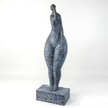 An abstract painted bronze sculpture of a lady