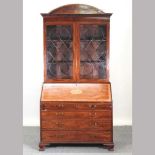 A George III mahogany associated bureau bookcase