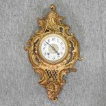 A Rococo style gilt cartel clock