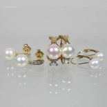 A pair of 14 carat gold diamond and cultured pearl earrings