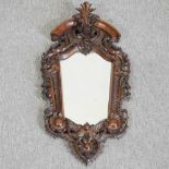 An Italian style carved wall mirror
