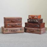 A collection of seven various vintage suitcases