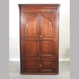 A George III oak standing corner cupboard