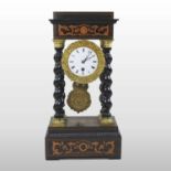 A 19th century French portico mantel clock