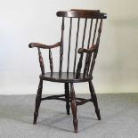 An early 20th century spindle back armchair