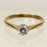 An 18 carat gold diamond solitaire ring