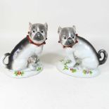 A pair of porcelain models of pug dogs