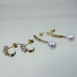 A pair of 10 carat gold diamond earrings