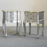 A pair of silver coloured bedside cabinets