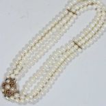 A 9 carat gold mounted three row cultured pearl necklace