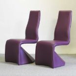 A pair of modern purple upholstered chairs