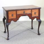 An antique style lowboy