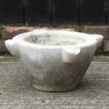 A large white marble mortar