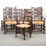 A set of eight rush seated spindle back dining chairs