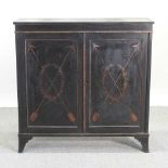 A Regency ebonised and gilt decorated side cabinet