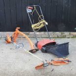 A Husqvana petrol garden strimmer