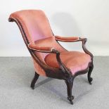 A Victorian mahogany and pink upholstered armchair