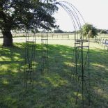 A black painted metal rose arbour