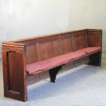 A large 19th century stained pine church pew