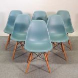 A set of six Vitra Eames moulded plastic dining chairs