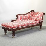 A Victorian carved mahogany chaise longue