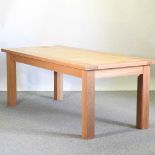 A modern light oak dining table