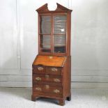 A small 19th century oak bureau bookcase