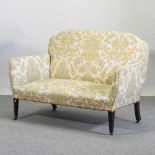 An Edwardian floral upholstered sofa