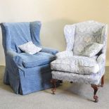 An early 20th century blue upholstered wing armchair