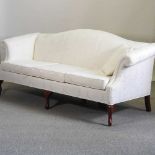 A George III style white upholstered hump back sofa