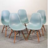A set of five Vitra Eames moulded plastic dining chairs