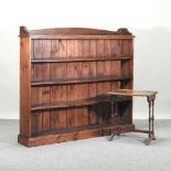 A stained pine open bookcase