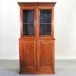 An Edwardian mahogany and inlaid cabinet bookcase