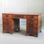 A reproduction pedestal desk