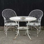 A cream painted wirework garden table