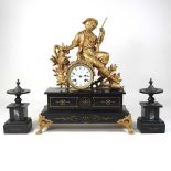 A 19th century French black slate clock garniture