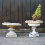 An ornate garden urn on stand,