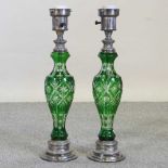 A pair of metal and green cut glass table lamps