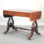 A reproduction mahogany sofa table