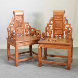 A pair of modern Chinese hardwood armchairs